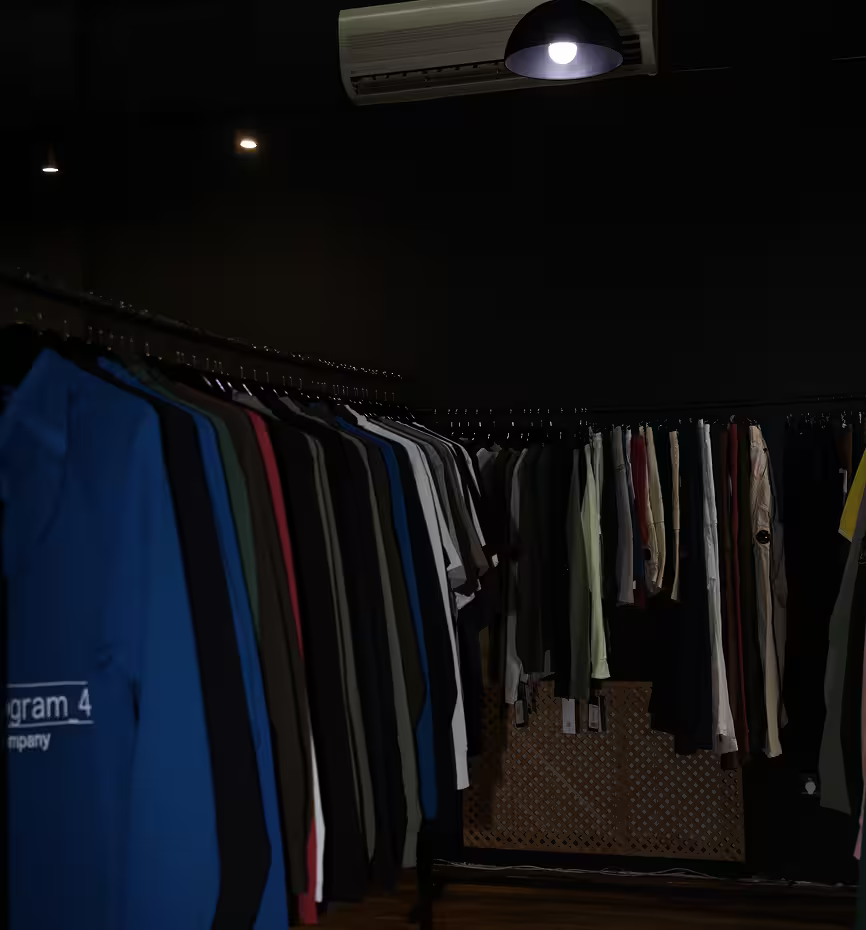 Dark fashion store interior with clothing rack display