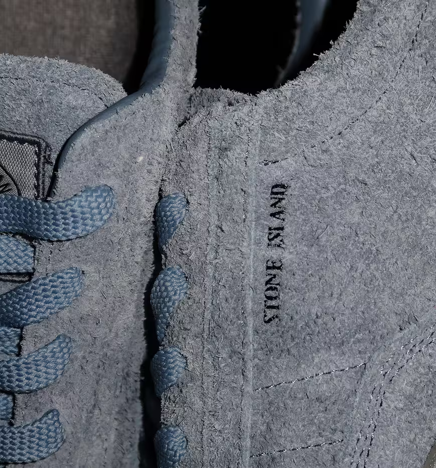Close-up of Stone Island grey suede sneakers