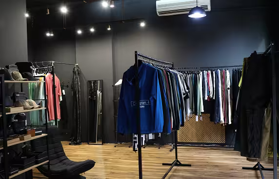 Clothing showroom interior with curated apparel and minimalist design