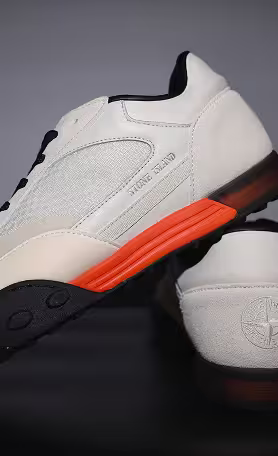 Stone Island sneakers in white with orange sole detail