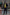 Man wearing black Stone Island urban outfit on city street